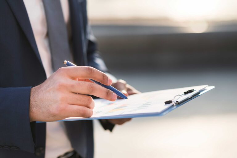 close-up-business-man-checking-clipboard